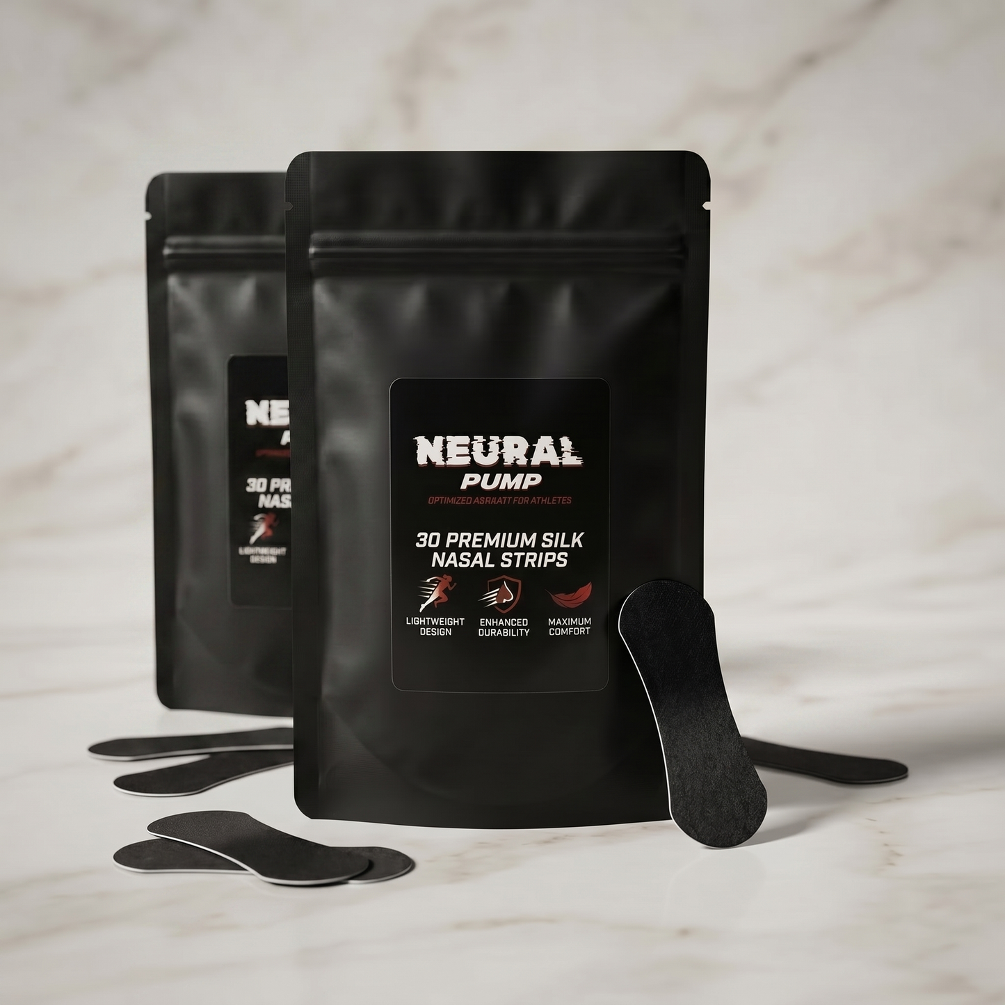 Two black packages of Neural Pump nasal strips on a marble surface