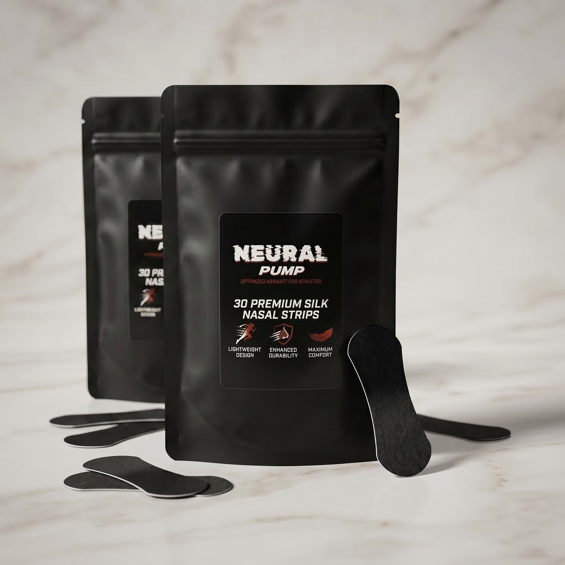 Two black packages of Neural Pump nasal strips on a marble surface